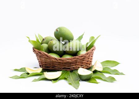 Fresh Green Raw Mango Also Called Aam, Kairi In Tradition Indian Wooden Basket Has Multiple Health Benefits, Is Rich Source Of Vitamins. Used For Chut Stock Photo