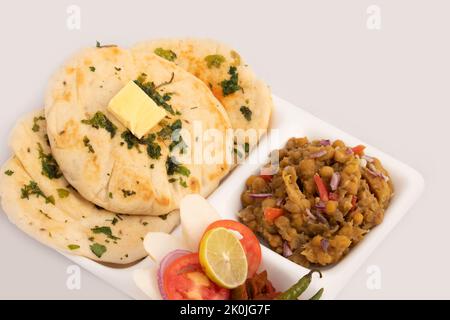 Chole Kulche Also Called Matar Kulcha, Chhole Kulche Is Widely Popular Delhi Street Food. The Dish Comprises Of Mildly Leavened Soft Fluffy Flatbread Stock Photo