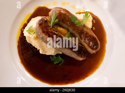 Cumberland sausage with mashed potatoes and gravy Stock Photo