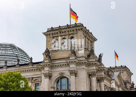 Tower from Reichstag with German flag in German capital Berlin, Germany Stock Photo