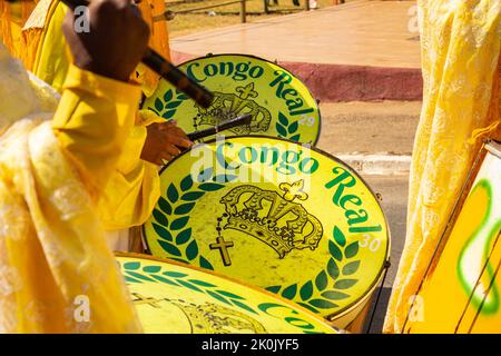 Goiânia, Goias, Brazil – September 11, 2022: Detail of some revelers using yellow drums during the Congadas, an Afro-Brazilian cultural and religious Stock Photo