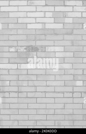 Typical common weathered brick wall in a faded black and white monochrome background. Stock Photo