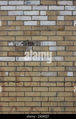 Typical common weathered brick wall. Stock Photo