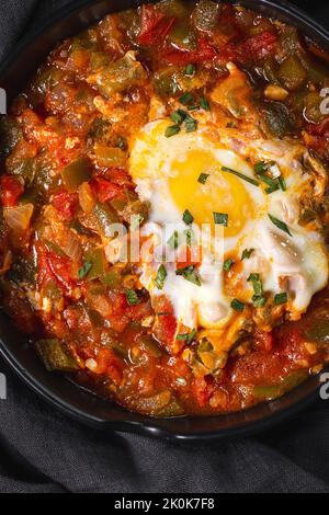 High angle of appetizing traditional Spanish dish made of egg and assorted vegetables and served in bowl on table Stock Photo