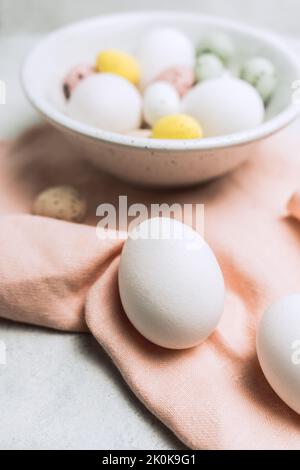 Still life of beautiful painted Easter eggs over white table background Stock Photo