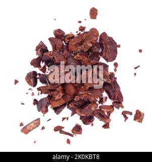 Cocoa crumb. Peeled cacao beans, isolated on white background. Roasted and aromatic cocoa beans, natural chocolate. Top view Stock Photo