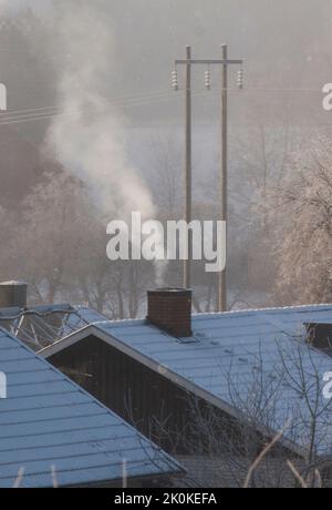 SMOKE from the chimney on a winter´s day Stock Photo