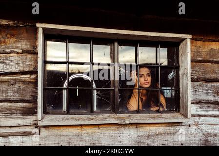 Woman In Ranch Style House Climbing Ladder To Bunk Bed Canvas