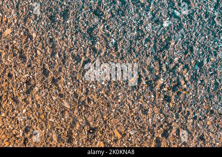 old asphalt texture with brown tint gradient overlaid, selective focus Stock Photo