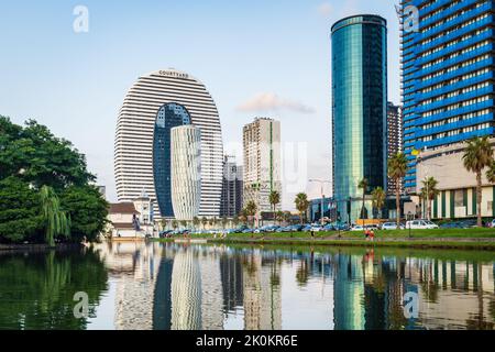 Batumi, Georgia - August 2022: Batumi skyline nightscape with fountains, skyscrapers including landmark Marriott hotel Stock Photo