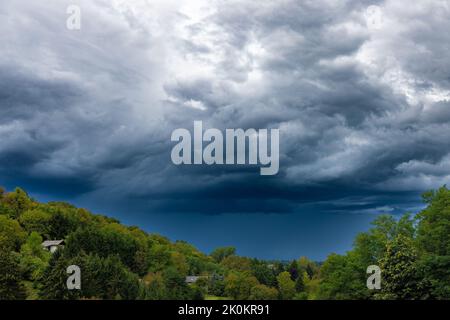 Stormy clouds over the hills in the countryside, Croatia Stock Photo
