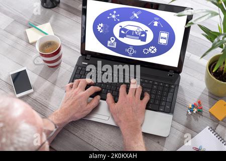 Driverless car concept shown on a laptop used by a man Stock Photo