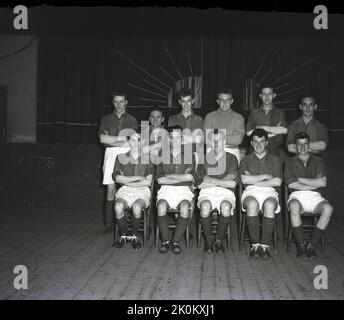 1956, historical, group photo in village hall of St Mary's football team, Leeds, England, UK. Stock Photo