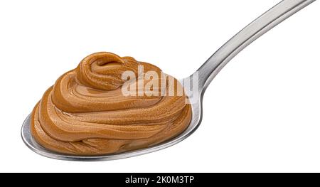 Peanut butter in spoon isolated on white background Stock Photo