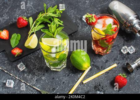 https://l450v.alamy.com/450v/2k0m4c2/fresh-mojito-cocktail-set-with-lime-mint-strawberry-and-ice-in-glass-on-stone-background-summer-cold-alcoholic-non-alcoholic-drinks-beverages-ste-2k0m4c2.jpg