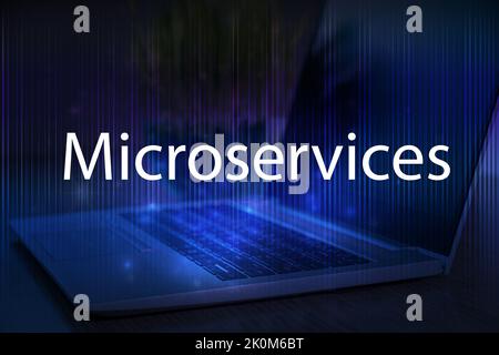 Microservices text on blue technology background with laptop. Stock Photo