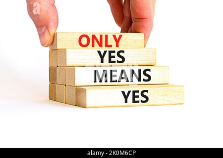 Only yes means yes symbol. Concept words Only yes means yes on wooden blocks on a beautiful white table white background. Businessman hand. Business, Stock Photo