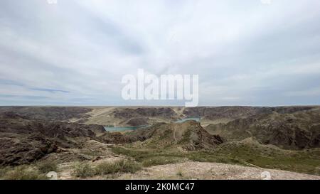 a big river in the steppe among the hills. Stock Photo