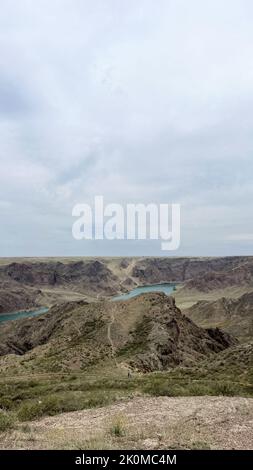 a big river in the steppe among the hills. Stock Photo