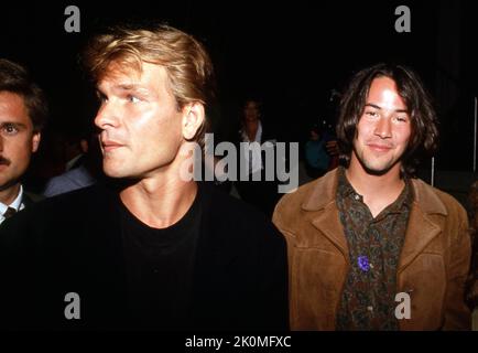 Patrick Swayze and Keanu Reeves at the premiere of 'Point Break' on July 10, 1991 at Avco Center Theater in Westwood, California.. Credit: Ralph Dominguez/MediaPunch Stock Photo