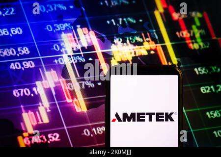 KONSKIE, POLAND - September 10, 2022: Smartphone displaying logo of Ametek company on stock exchange diagram background Stock Photo