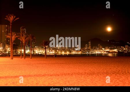 Benidorm, Alicante, Spain- September 11, 2022: Beautiful panoramic view of Benidorm town on a full moon night Stock Photo