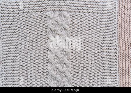 Knitted pattern of gray wool in form of close-up vertical harness Stock Photo
