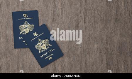 Saint Lucia passport on a wooden board, Citizenship by Investment, close-up Stock Photo