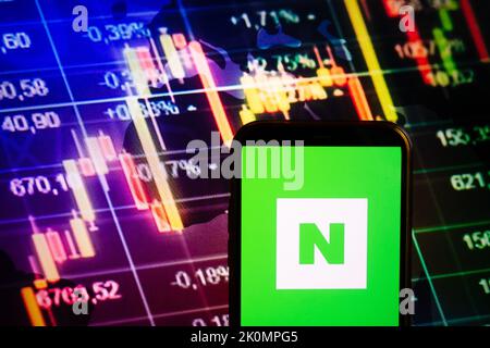 KONSKIE, POLAND - September 10, 2022: Smartphone displaying logo of Naver company on stock exchange diagram background Stock Photo