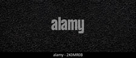 banner of macro black polyurethane foam rubber washcloth sponge Stock Photo