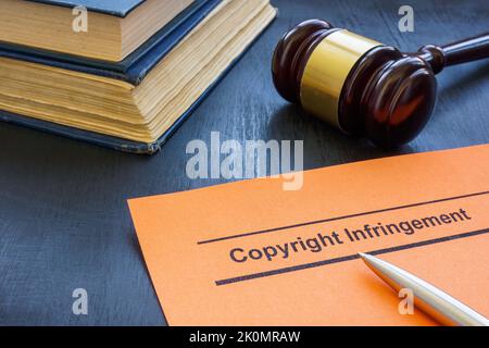 A Document about copyright infringement and gavel. Stock Photo