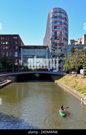 Utrecht, Netherlands - August 2022: Two people kayaking on a canal in the city centre Stock Photo