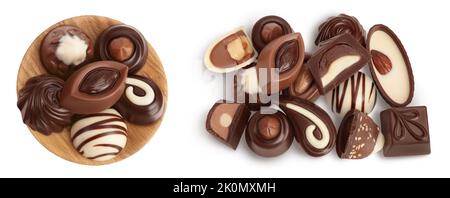 Chocolate candy in wooden bowl isolated on white background with full depth of field. Top view. Flat lay Stock Photo