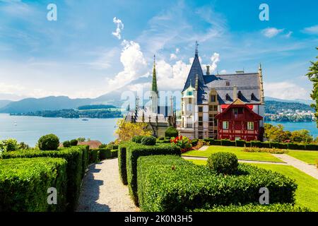 19th century Meggenhorn Castle overlookig Lake Lucerne and the Alps, Meggen, Switzerland Stock Photo