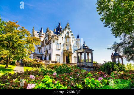 19th century Meggenhorn Castle overlookig Lake Lucerne and the Alps, Meggen, Switzerland Stock Photo