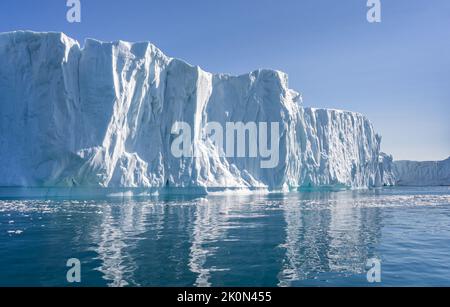 Towering great icebergs in the Ilulissat Icefjord in Greenland Stock Photo