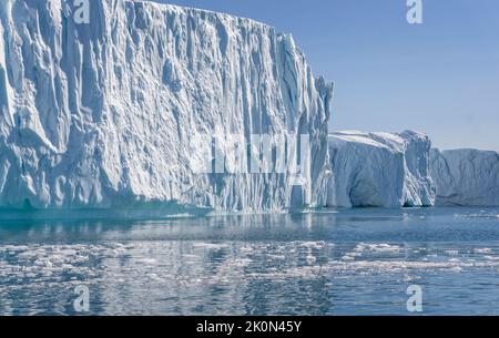 Towering great icebergs in the Ilulissat Icefjord in Greenland Stock Photo