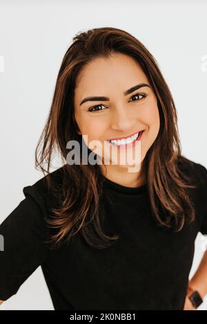 Headshot of young professional female smiling at camera Stock Photo