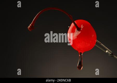 Maraschino cherry with goopy drip Stock Photo