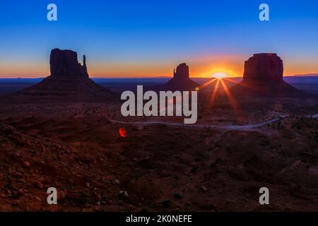 The Mittens, three buttes in Monument Valley at sunrise, Arizona and Utah, USA Stock Photo
