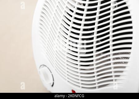 Electric fan heater on floor, closeup Stock Photo