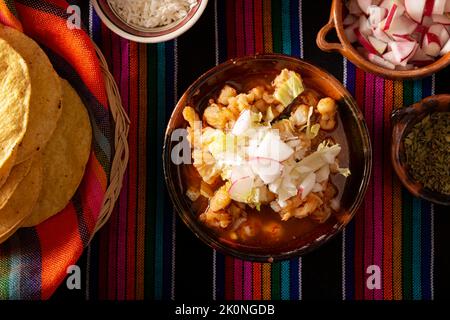 Pozole Rojo. Traditional mexican stew very popular in mexico and neighboring countries. Made from cacahuazintle with meat and various other ingredient Stock Photo