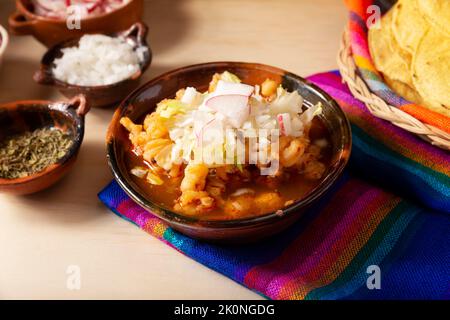 Pozole Rojo. Traditional mexican stew very popular in mexico and neighboring countries. Made from cacahuazintle with meat and various other ingredient Stock Photo