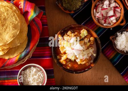 Pozole Rojo. Traditional mexican stew very popular in mexico and neighboring countries. Made from cacahuazintle with meat and various other ingredient Stock Photo