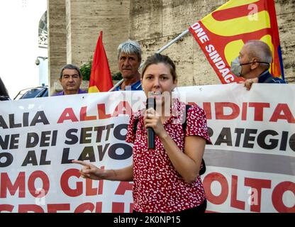 Rome, Italy. 12th Sep, 2022. Press conference under the Ministry of Economic Development (Mise) to denounce the dismantling and privatization of the country's air transport and the attack on the world of work. The microphone was attended by the candidates of Popular Union (left movement born in July 2022, supported by various parties and associations including DeMa, Manifesta, Potere al Popolo and Rifondazione Comunista), exponents of grassroots trade unionism (Usb) and workers of the air transport on the day of the national strike. In the photo Beatrice Gamberini, candidate with the Popul Stock Photo