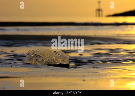Dirty used plastic waste on the beach. Problem of spilled rubbish trash garbage on the beach sand caused by man-made. Environmental and ecology concep Stock Photo