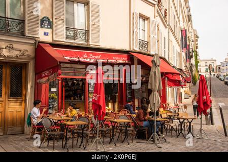 Paris, France. August 2022. Bistrot in Montmartre, one of the most vibrant and popular districts of Paris, the French capital. High quality photo Stock Photo