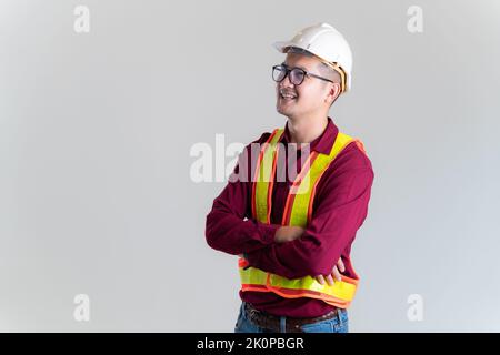 Portrait of happy young foreman with hard hat in a studio. Architect, Engineer, Civil Concept of Construction. Stock Photo