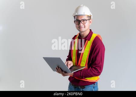 Architect, civil engineer with laptop in a studio. Architect, Engineer, Civil Concept of Construction. Stock Photo