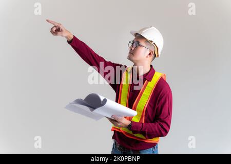 Architect civil engineer working with  blueprints in a studio. Architect, Engineer, Civil Concept of Construction. Stock Photo